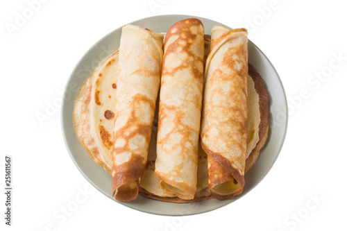 Thin pancakes on a plate isolated on a white background.