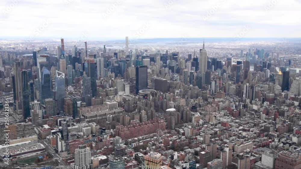 Midtown Manhattan skyline on a cloudy day as seen from a moving helicopter over the city