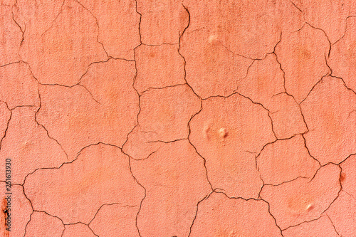 texture of an old wall painted with pink paint