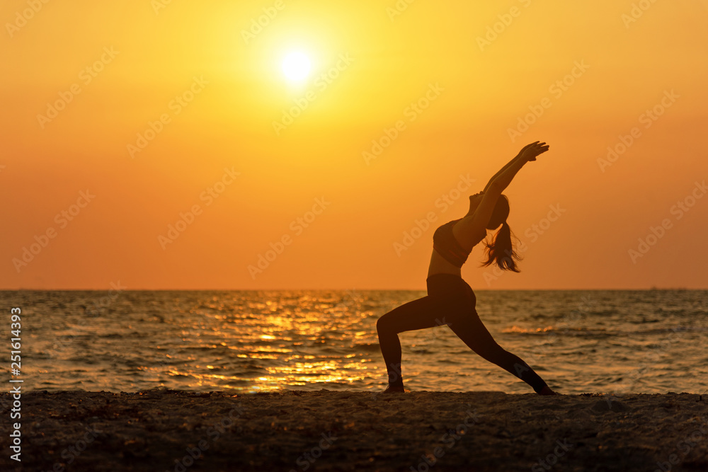 Meditation yoga spirit lifestyle mind woman peace vitality, silhouette outdoors on the Sea sunrise, relax vital abstract. Healthy Concept