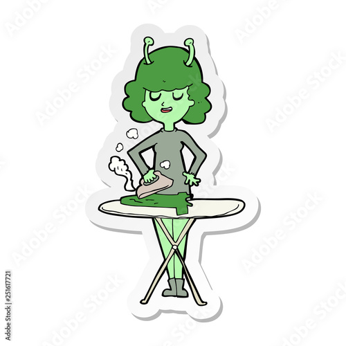 sticker of a cartoon alien woman ironing