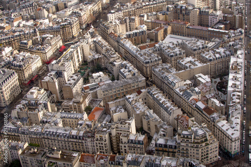 Paris in winter buildings with snow on the roofs from above 