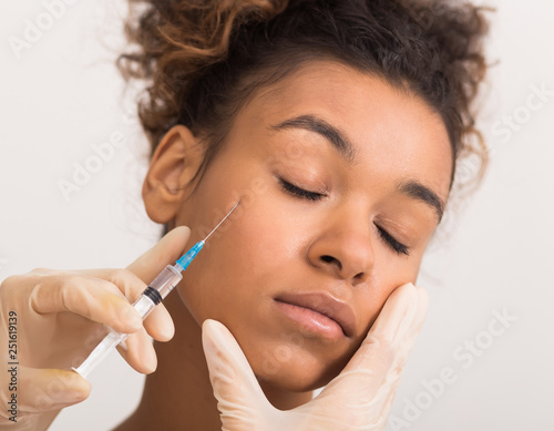 Beauty injection. Woman receiving hyaluronic acid, crop