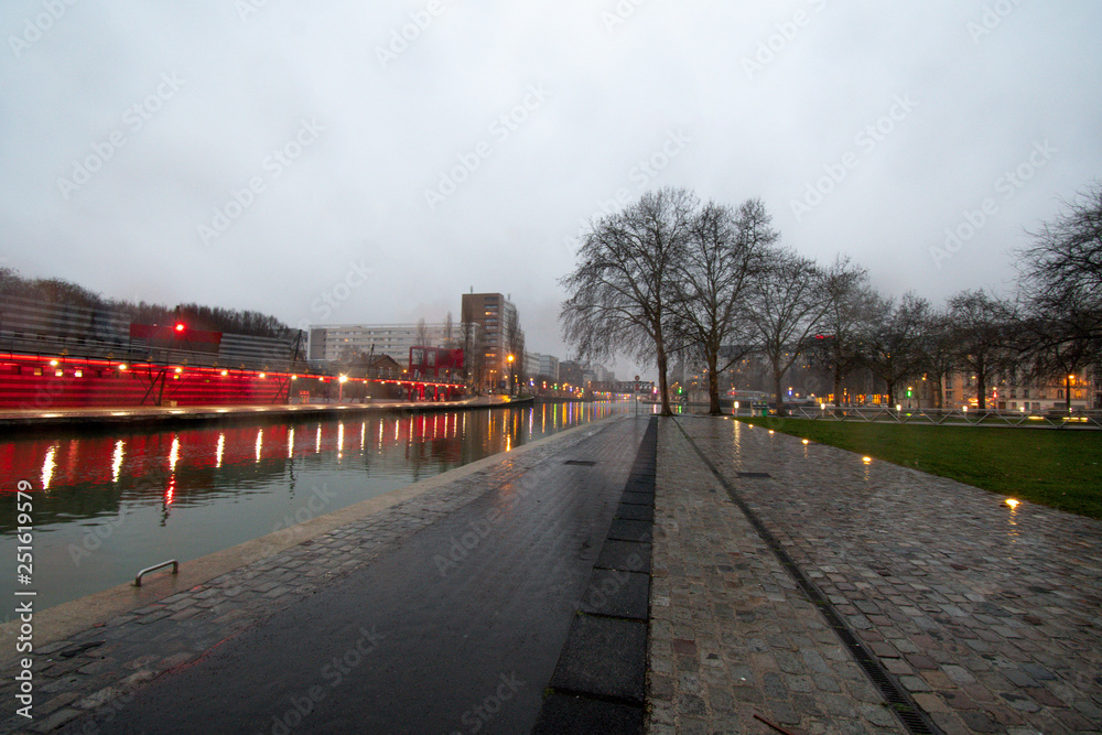 Paris in winter St Denis channel on a rainy night