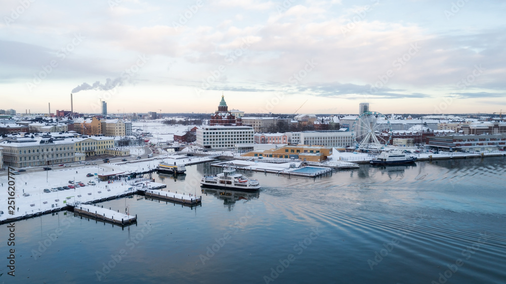 Ariel panoramic view of Helsinki at winter with a Cathedral church and Market Square area on the shore of Baltic Sea. Finland