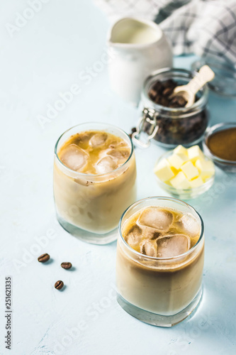 Iced bulletproof coffee. Selective focus  space for text.