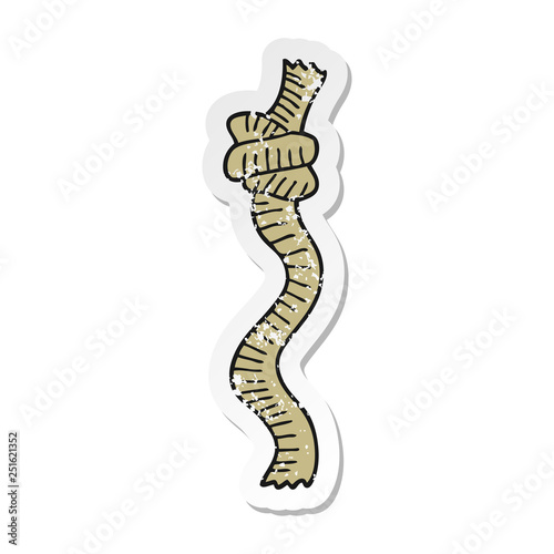 distressed sticker of a cartoon knotted rope
