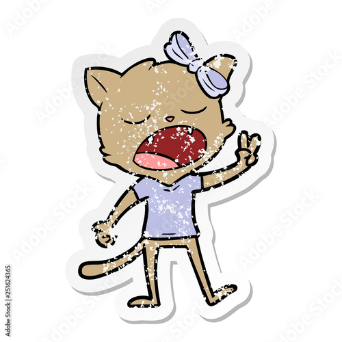 distressed sticker of a cartoon yawning cat