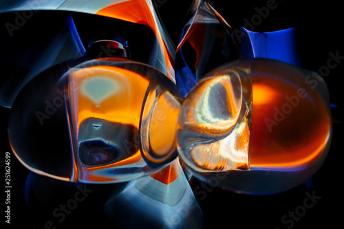 Multicolored balls, refractions of colored rays of light through water and glass