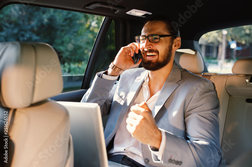 Businessman talking on the phone in a taxi © djile