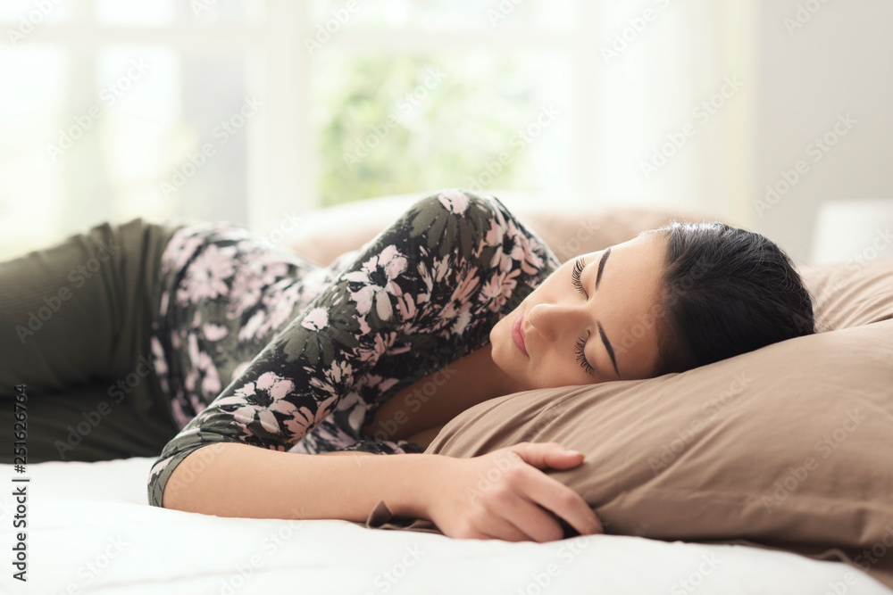 Young beautiful woman napping on the bed Young beautiful woman napping on the bed