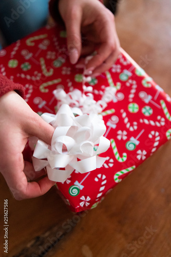 Close up of woman's hand holding Christmas gift