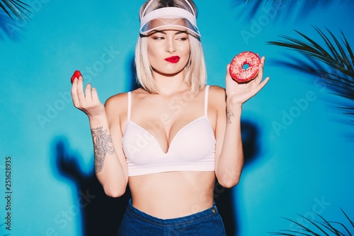 Cute girl posing with donuts