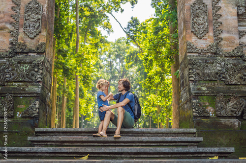 Dad and son travelers discovering Ubud forest in Monkey forest, Bali Indonesia. Traveling with children concept photo