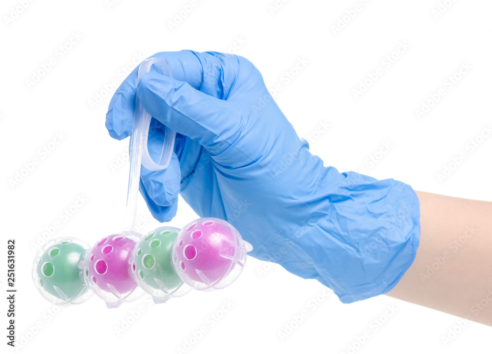 Toilet balls cleaner in cleaning glove hand on white background isolation Toilet balls cleaner in cleaning glove hand on white background isolation