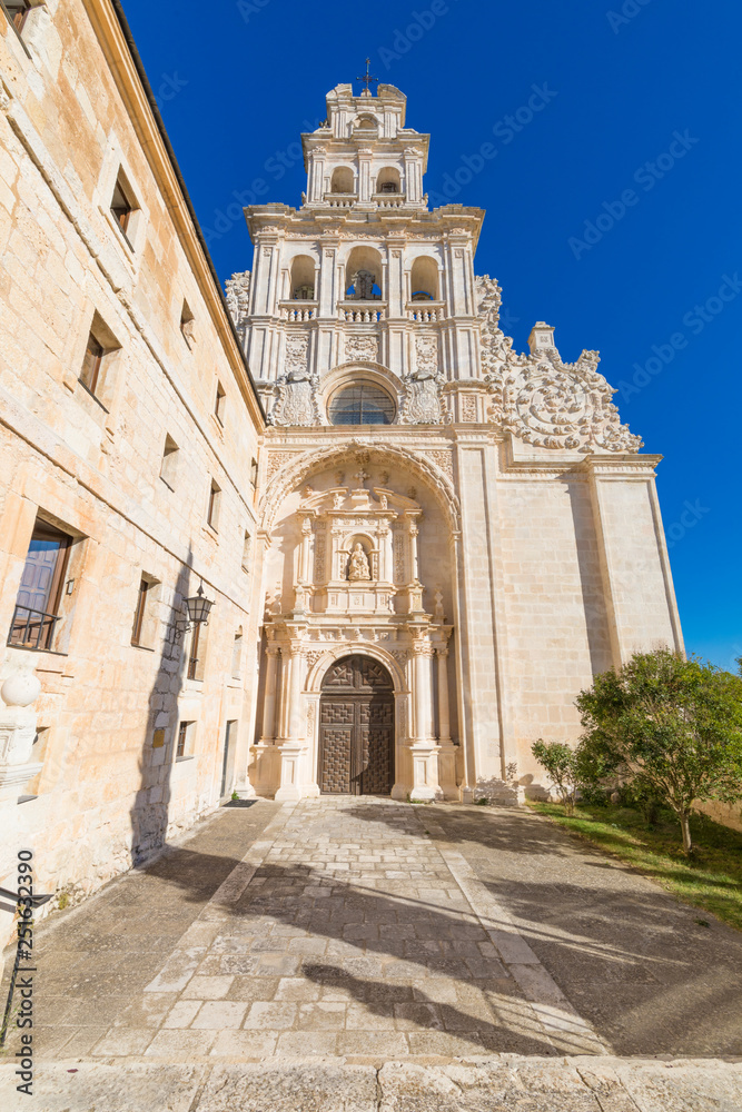 facade of church in Monastery Santa Maria de la Vid, landmark and monument from twelfth century, in Burgos, Castile and Leon, Spain, Europe, vertical shot