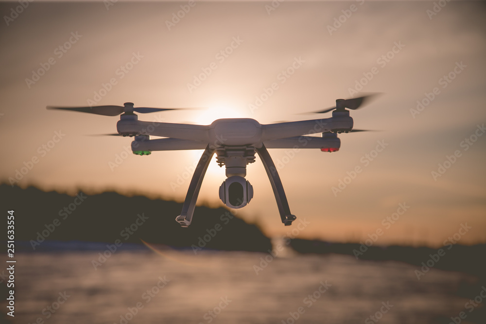 radio-controlled drone flies on a clear winter day radio-controlled drone flies on a clear winter day