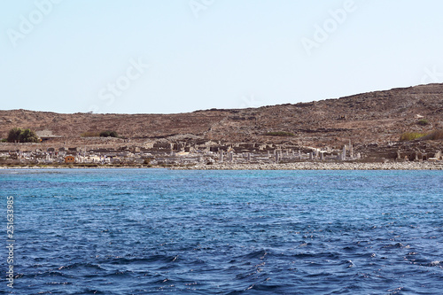 Beautiful view of the archaeological site of Delos from the ferry in the Cyclades Islands