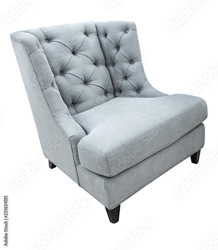 Gray classical vintage modern style armchair with fabric upholstery isolated on white background. Cozy fabric chair side angle view photo