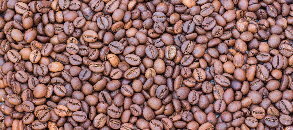 Background, texture of coffee beans, panorama. Coffee sale_ Background, texture of coffee beans, panorama. Coffee sale_
