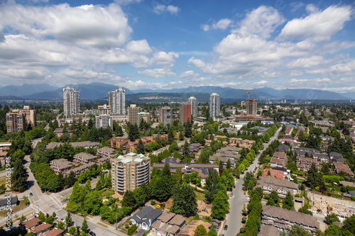 Aerial view of a modern city during a sunny summer day. Taken in Burnaby, Vancouver, BC, Canada.