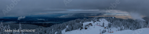 Fototapeta Naklejka Na Ścianę i Meble -  Panoramic view of Grouse Mountain Ski Resort during a cloudy winter sunset. Taken in North Vancouver, British Columbia, Canada.