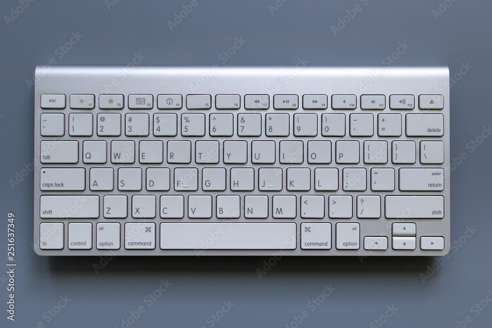 Top view image of Wireless keyboard on gray background Top view image of Wireless keyboard on gray background