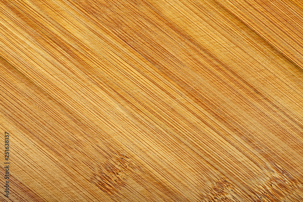 Bamboo cutting board texture. Wooden background. Bamboo cutting board texture. Wooden background.