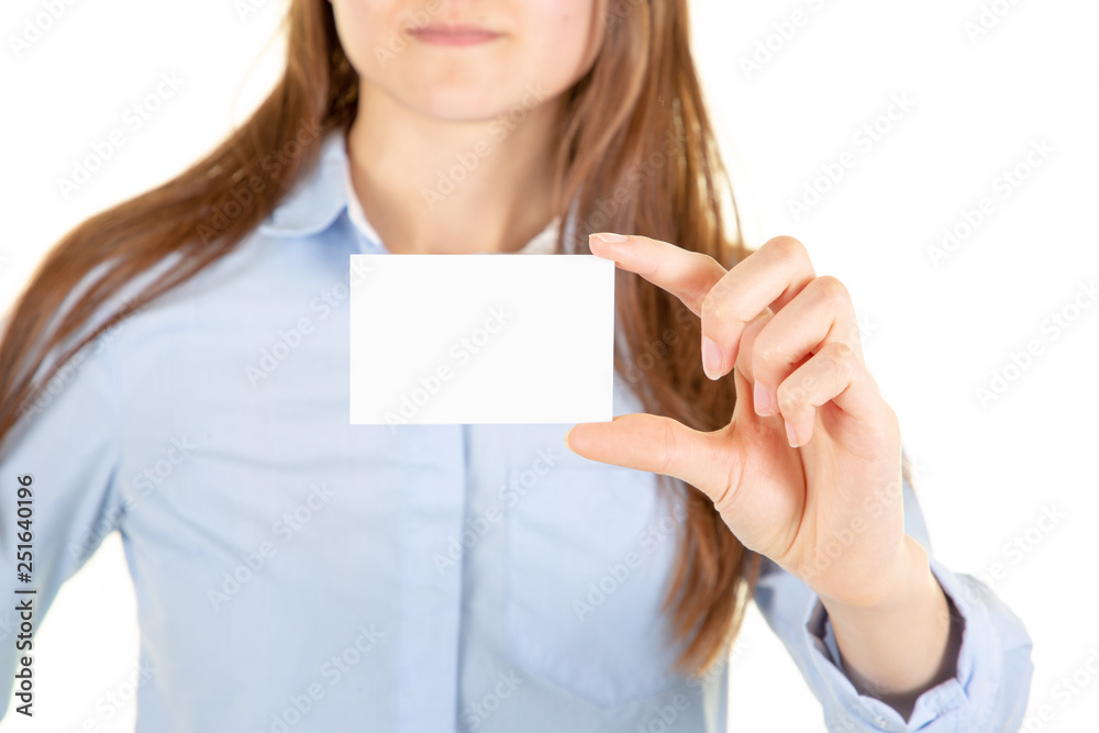young woman over grunge grey wall holding blank business visit card in hand young woman over grunge grey wall holding blank business visit card in hand