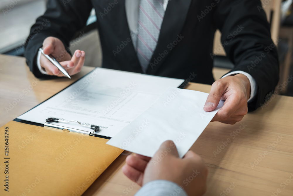 Businessman sending a resignation letter to employer boss in order to resign dismiss contract