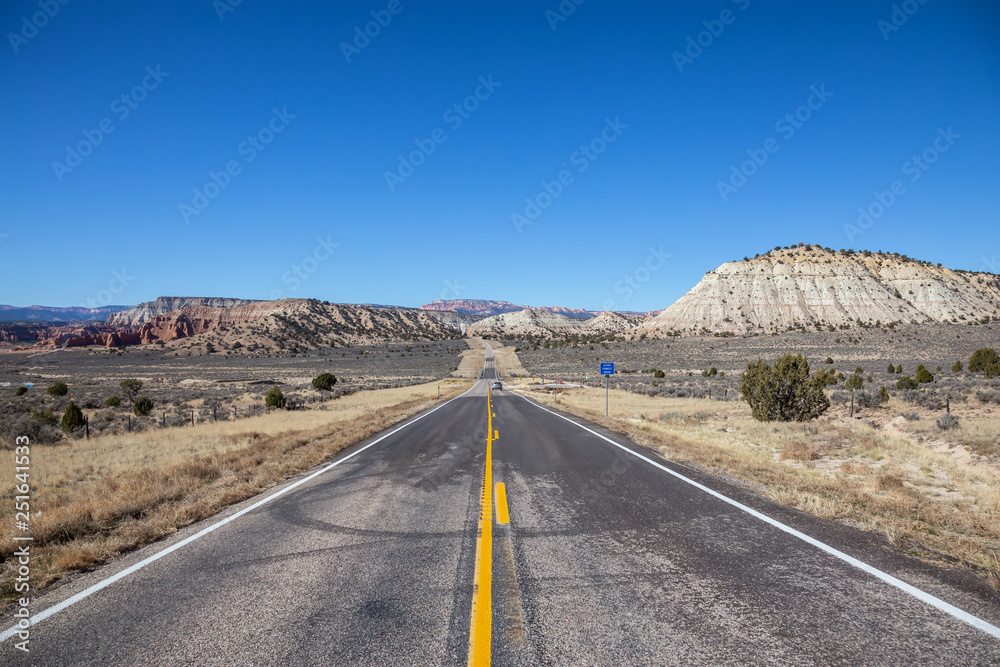 Scenic road in the desert during a vibrant sunny day. Taken on Route 12, Utah, United States of America. Scenic road in the desert during a vibrant sunny day. Taken on Route 12, Utah, United States of America.