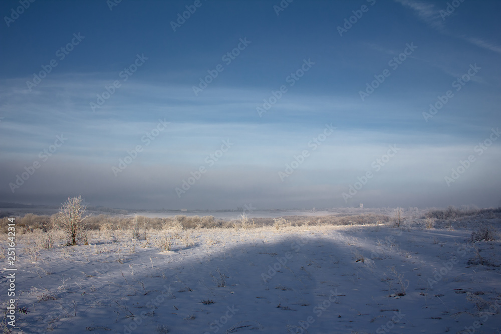 winter landscape with blue sky and clouds