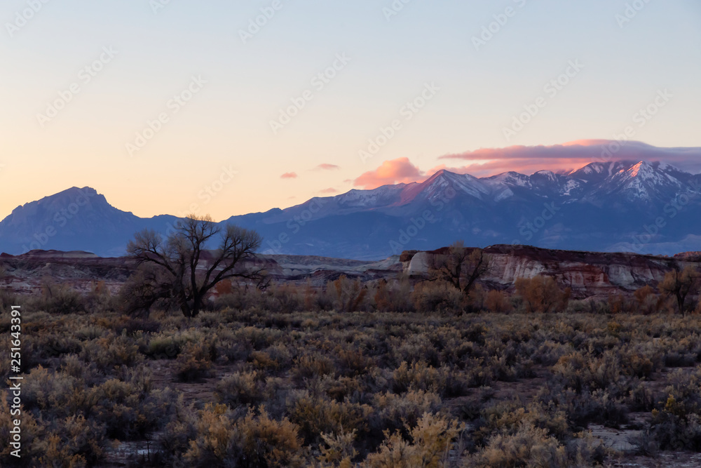 Beautiful American Landscape during a vibrant sunny sunrise. Taken near Hanksville, Utah, United States of America.