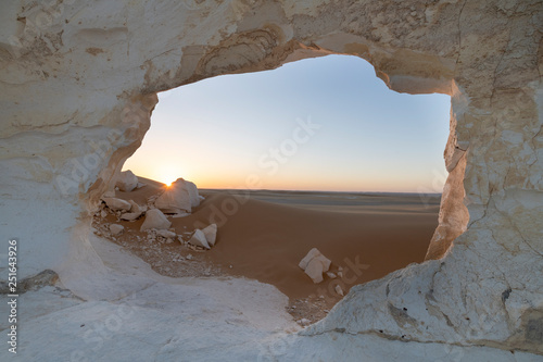 Sunset landscape with chalck rock formations at the White desert national park in Egypt photo