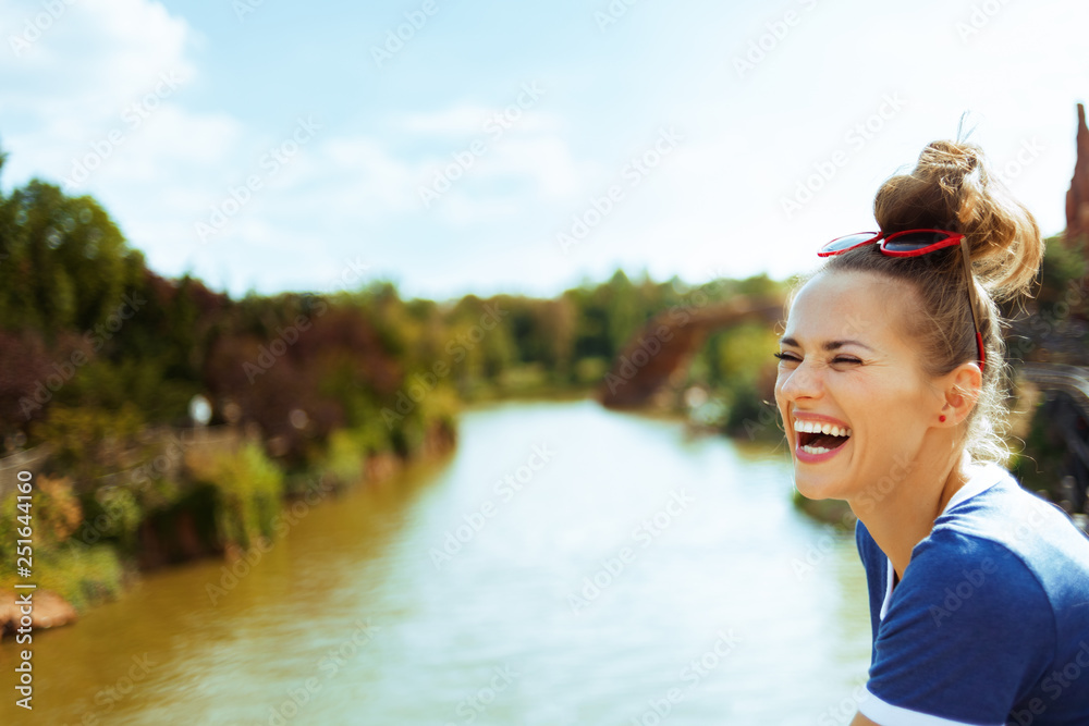 woman on river boat having fun time while river cruising