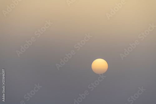Sunrise in the White Desert National Park in Egypt the morning after a sandstorm