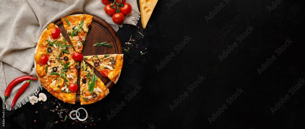 Tasty pizza with vegetables and herbs on cutting board