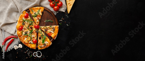 Tasty pizza with vegetables and herbs on cutting board