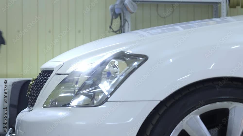 Man or auto mechanic closes the car hood. Vehicle service and maintenance concept. 4K UHD video footage, indoor. the repair is finished. Man or auto mechanic closes the car hood. Vehicle service and maintenance concept. 4K UHD video footage, indoor. the repair is finished.