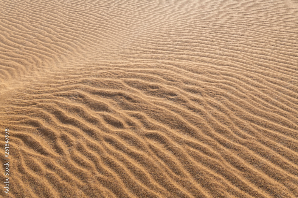 Amazing abstract background image of ripples and waves in the sand at sunrise Amazing abstract background image of ripples and waves in the sand at sunrise