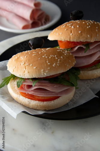 Hamburger with ham. Two burgers  hoemmade food. healthy sandwich with fresh vegetables.