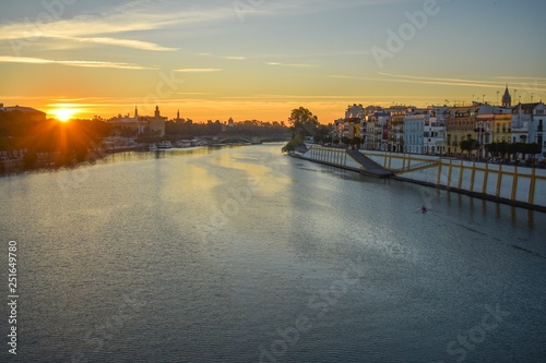 The Guadalquivir river that flows through Seville in the south of Spain, being transformed by the light of the rising sun. © JC