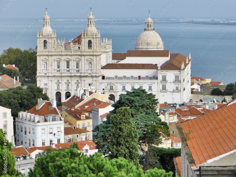 City scene with large church near the waterfront in Lisbon Portugal.