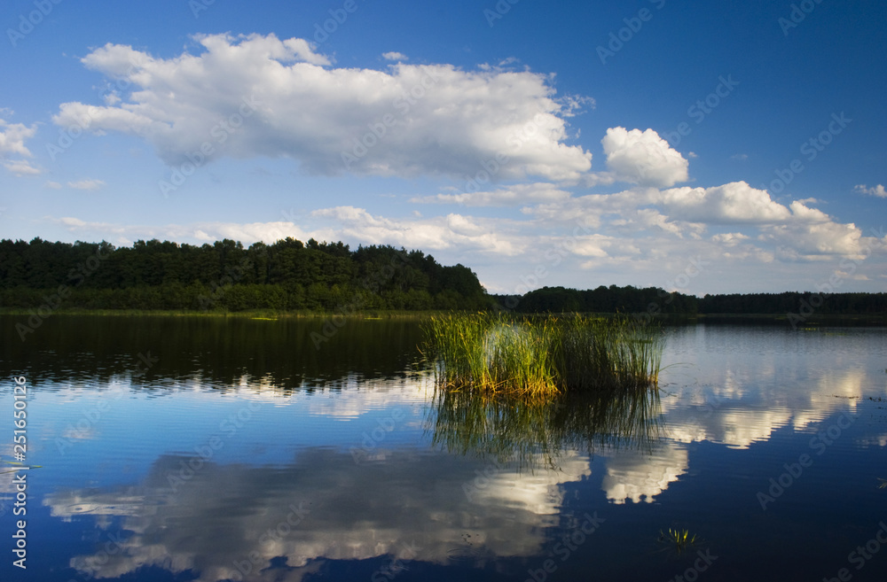 Lake and blue sky with clouds