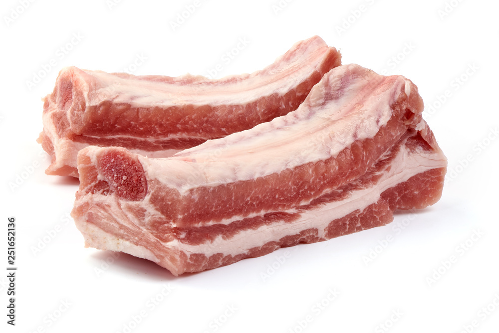 Raw fresh pork ribs, close-up, isolated on white background