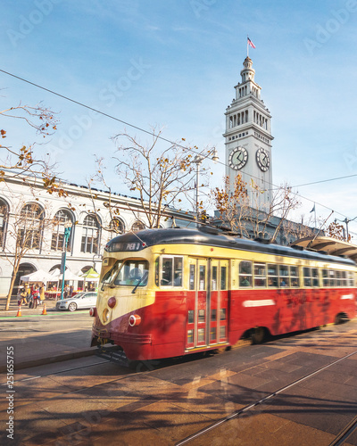 Photography Street car or trollley or muni tram in front of San Francisco Ferry Building in