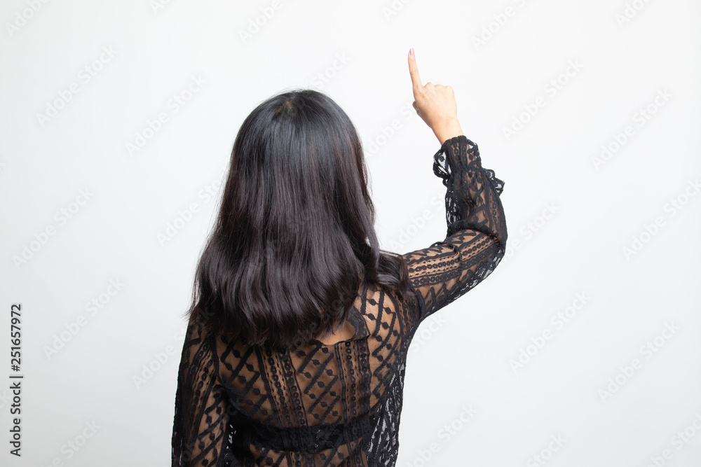 Back of Asian woman touching the screen with her finger. Back of Asian woman touching the screen with her finger.