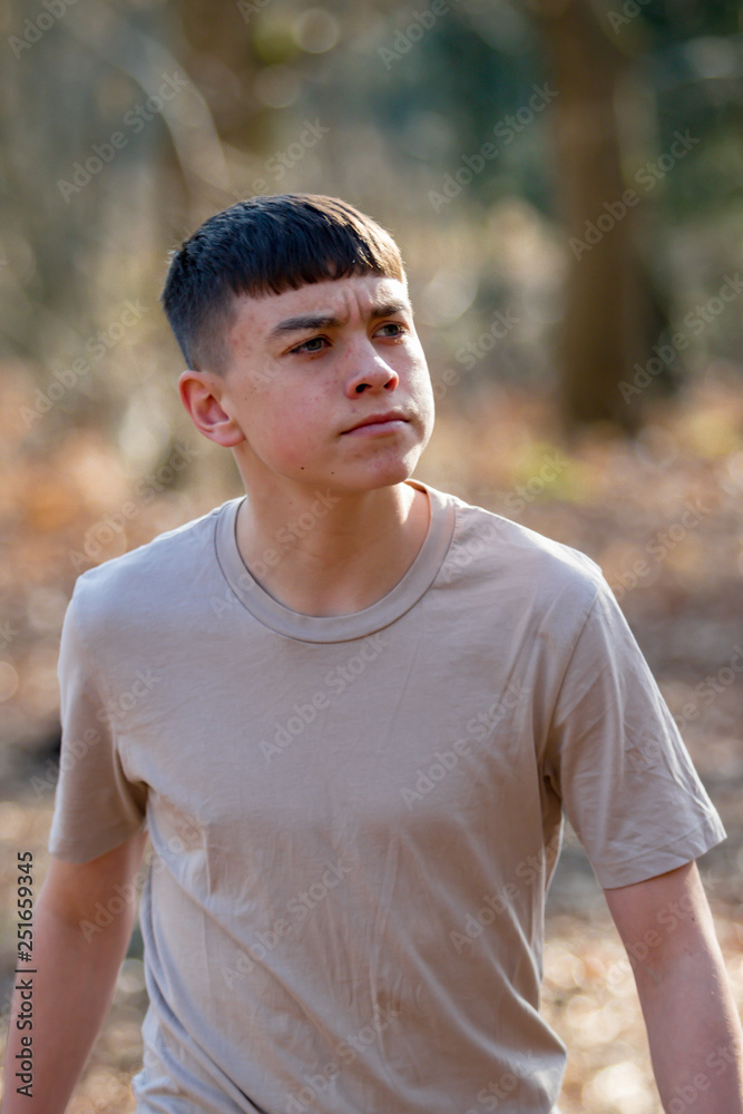 Teenage boy outside on a bright Spring day Teenage boy outside on a bright Spring day