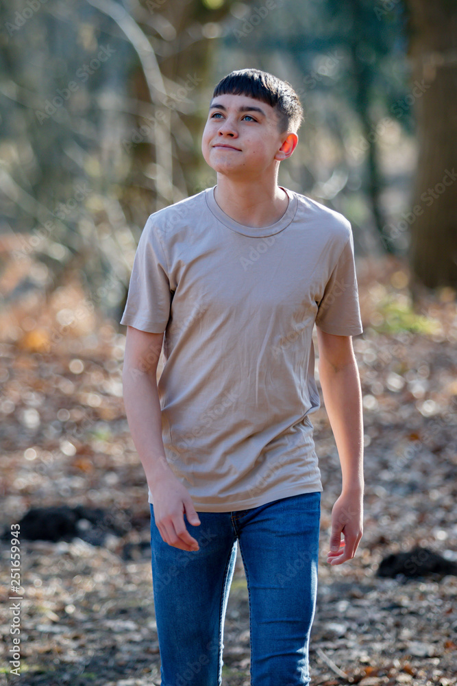 Teenage boy outside on a bright Spring day Teenage boy outside on a bright Spring day