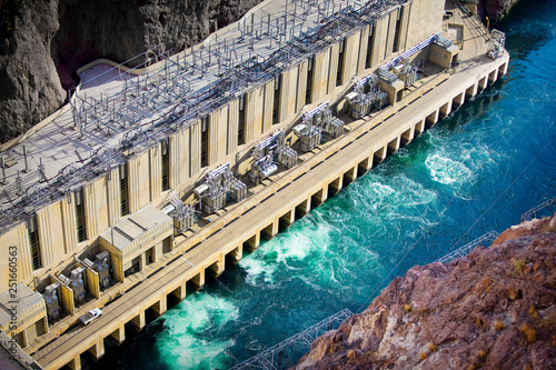 Large hydroelectric power plant at the edge of a river.